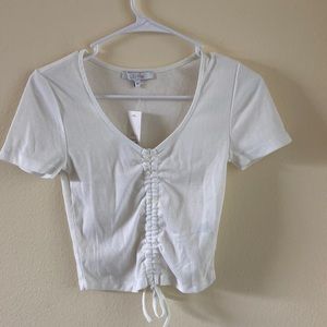 Francesca’s white cropped tee